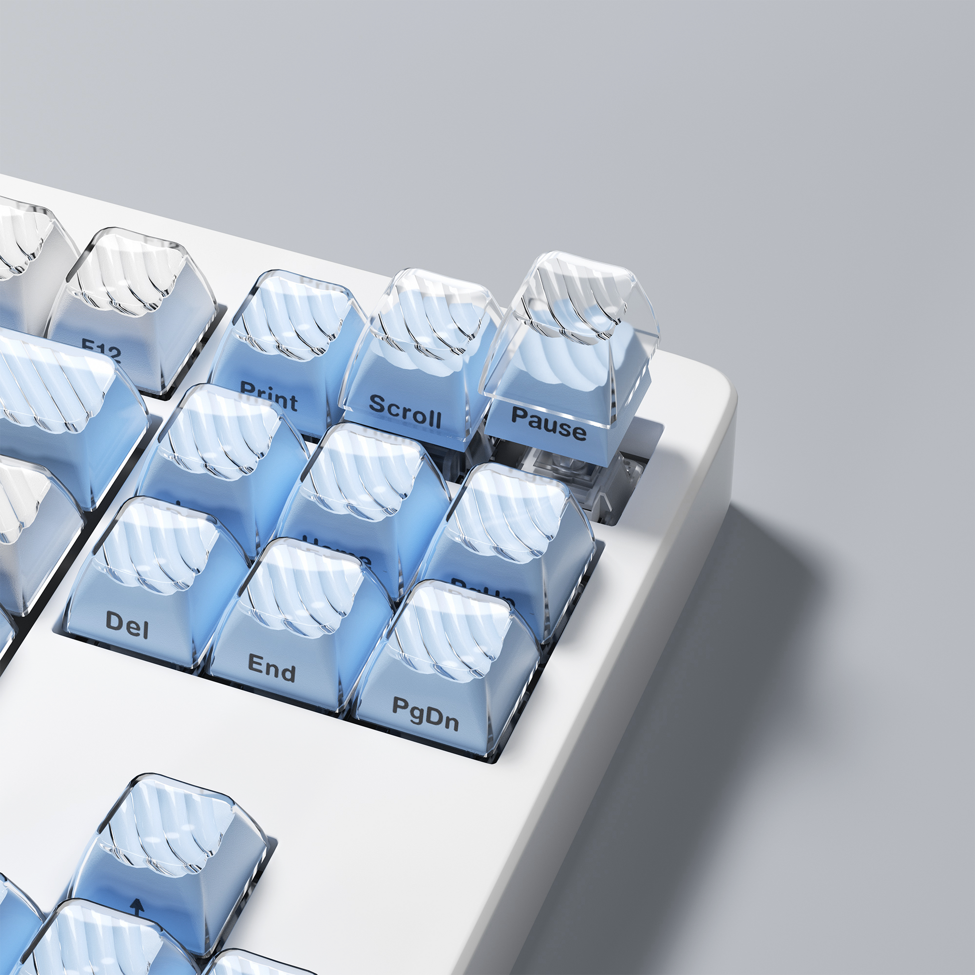 Blue transparent OEM profile keycaps with side legends on a keyboard layout