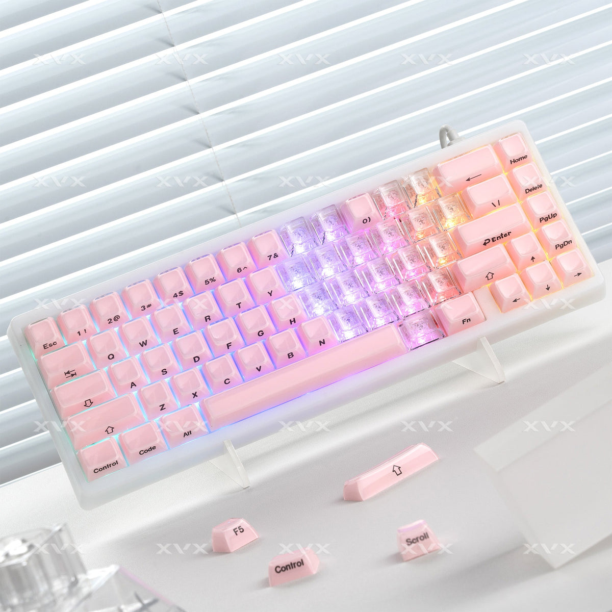 Pink-themed translucent keycap set with heart profiles and printed key legends