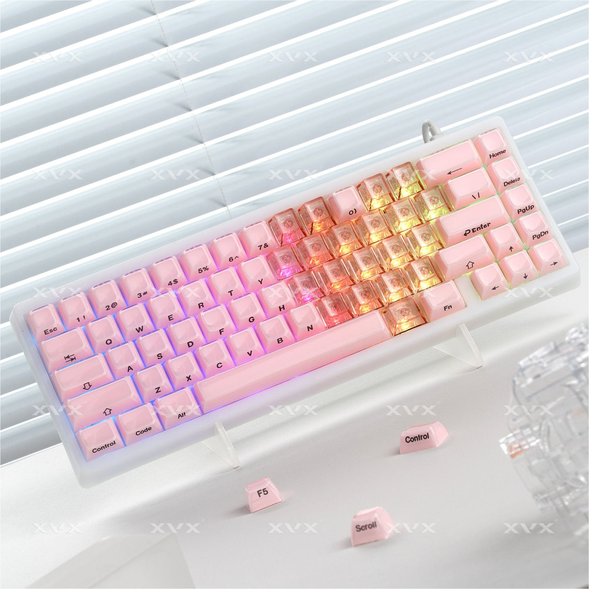 Pink, orange, and gold-lit keycap set with heart profiles and printed legends