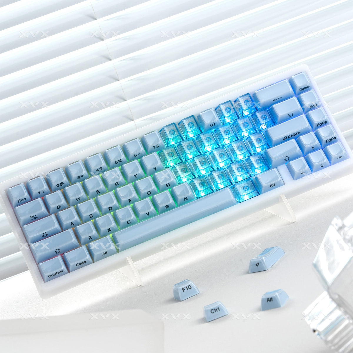 Light blue translucent Cherry-profile keycap set with heart logos on square caps