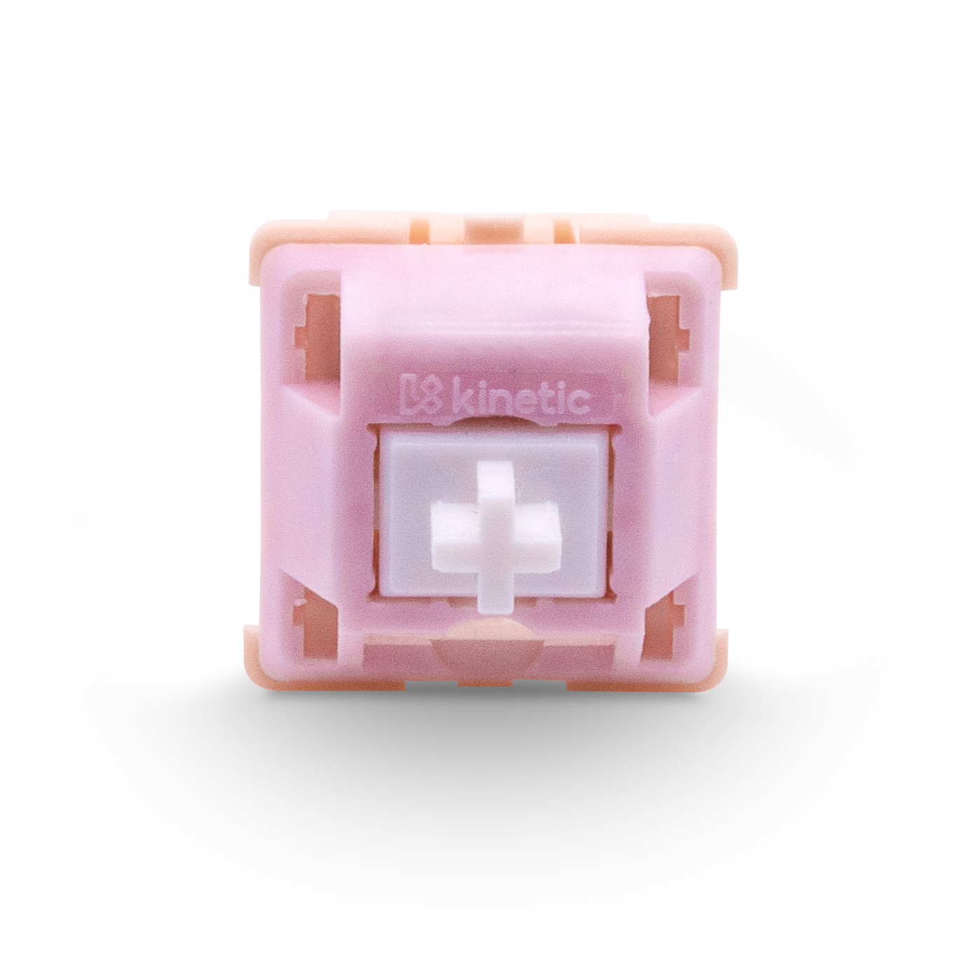 Kinetic tactile switch top view, pink housing and centered white cross stem