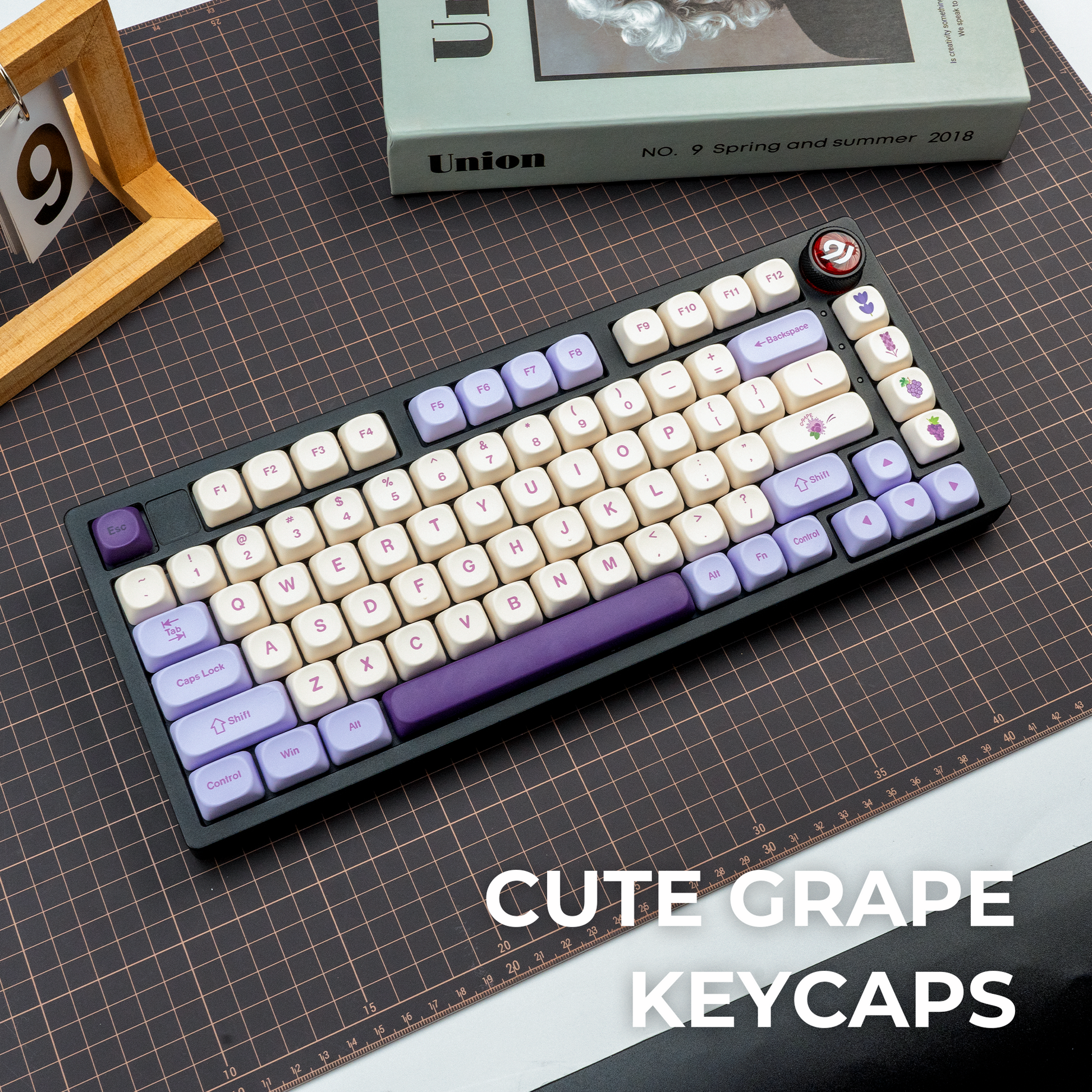 Mechanical keyboard keycap set in cream and purple with grape-themed novelty caps