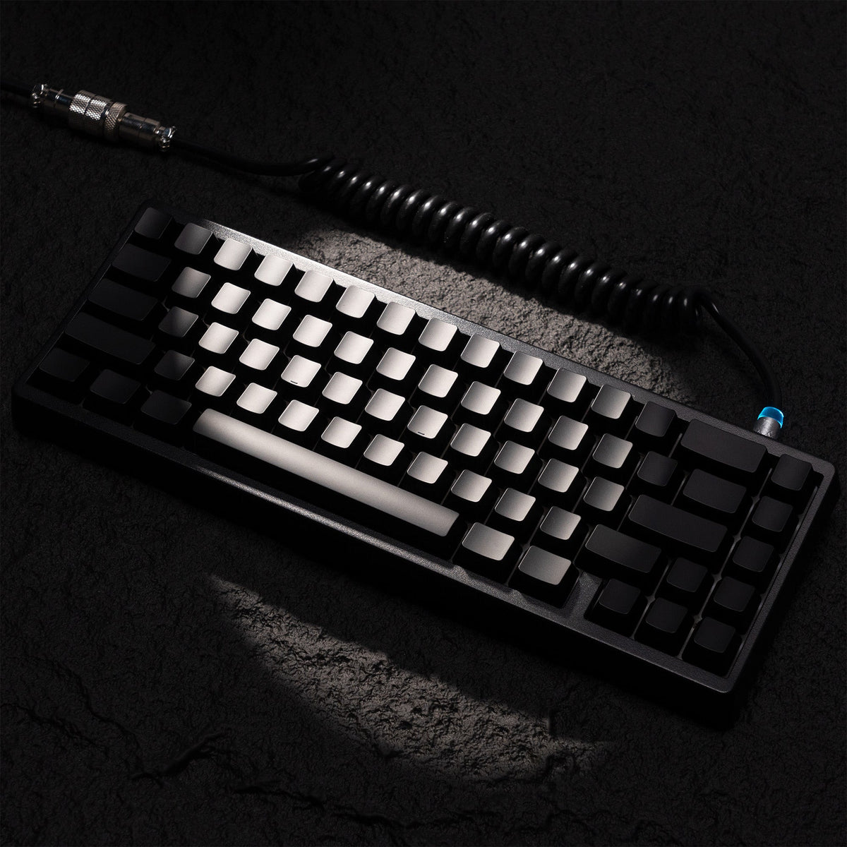 Topographic black keycap set with bright white shine-through legends