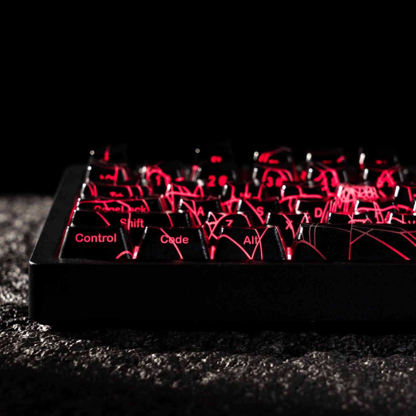 Keycap set with spider-web shine-through pattern, red backlit key legends