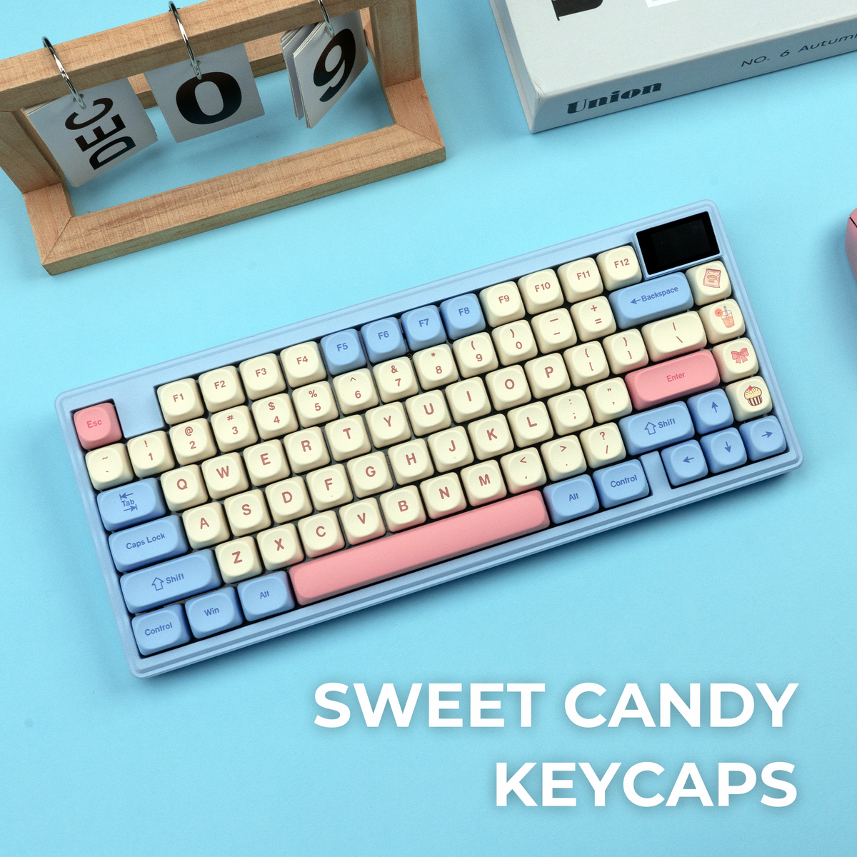 Pastel cream and light blue keycaps with pink accents across full keyboard layout