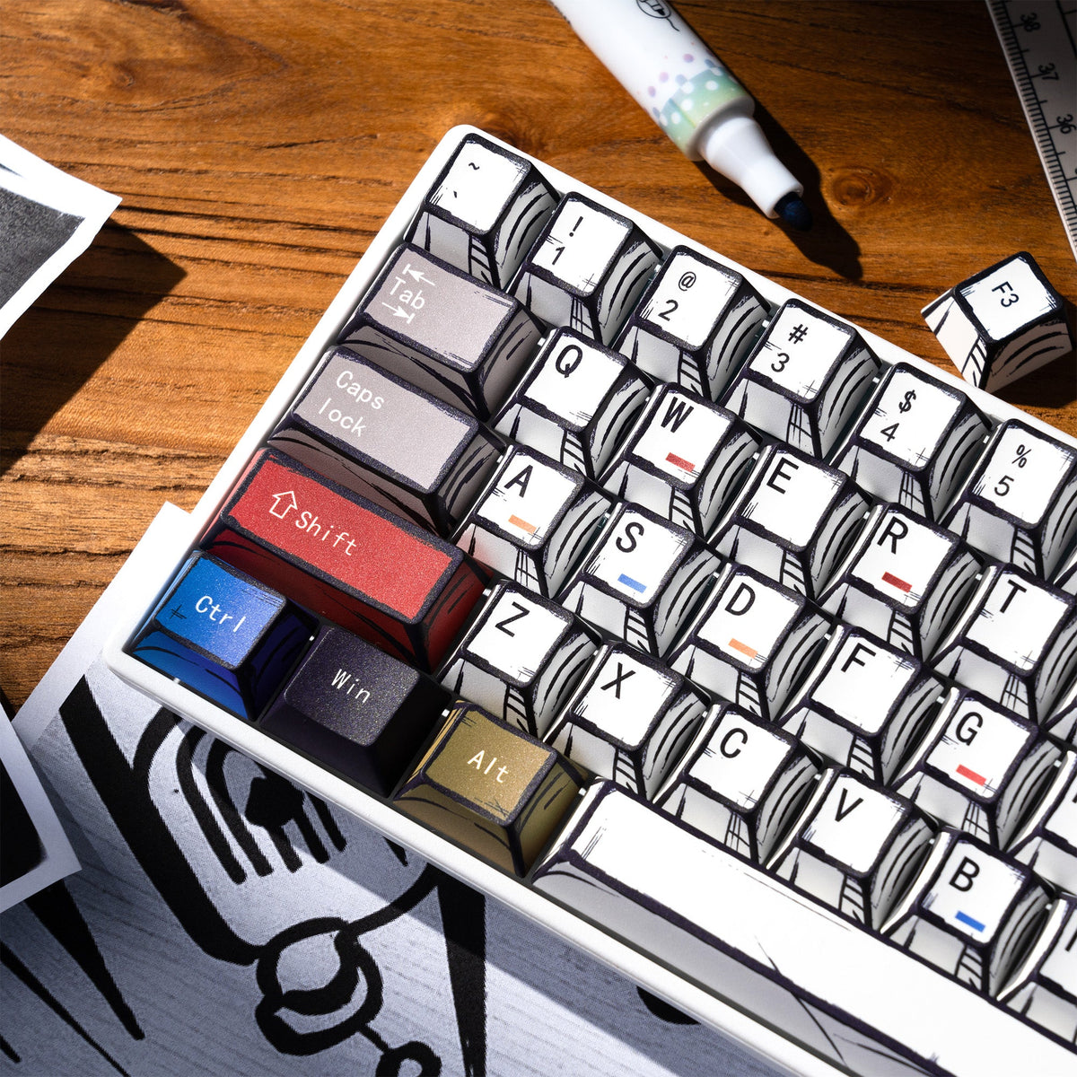 Close-up of keycap set with white and black caps plus blue and brown modifier keys
