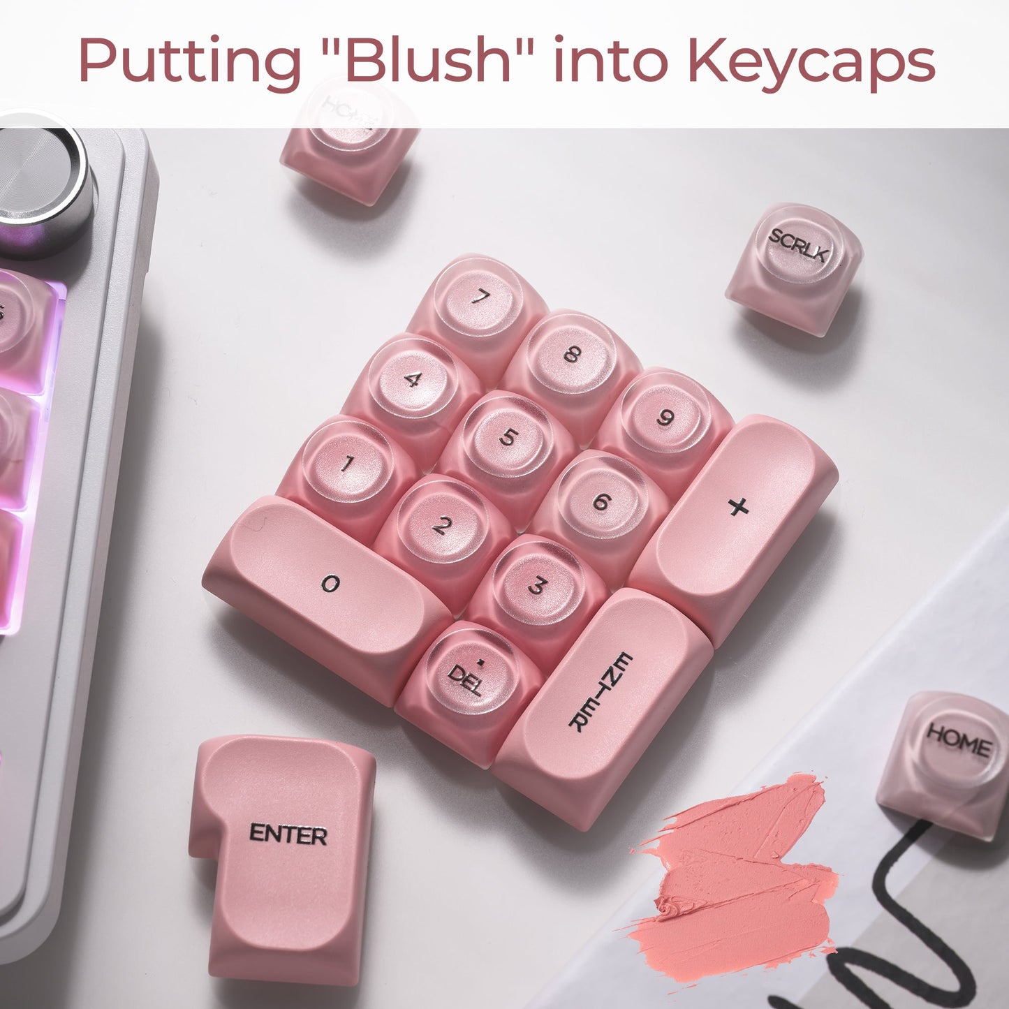 Blush pink keycaps grouped together showing Enter, Backspace, and number row legends