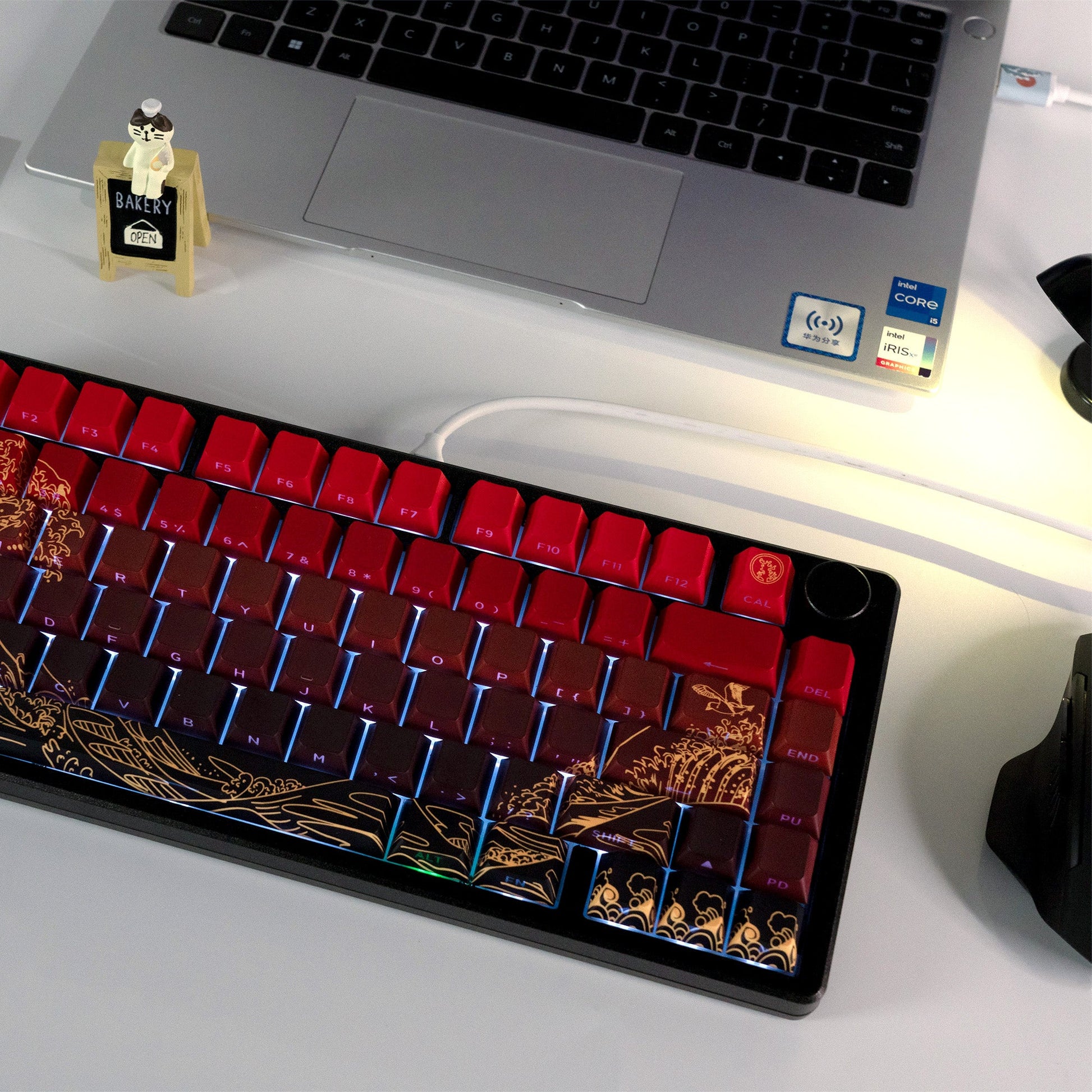 Red keycap set with gold side artwork installed on a mechanical keyboard
