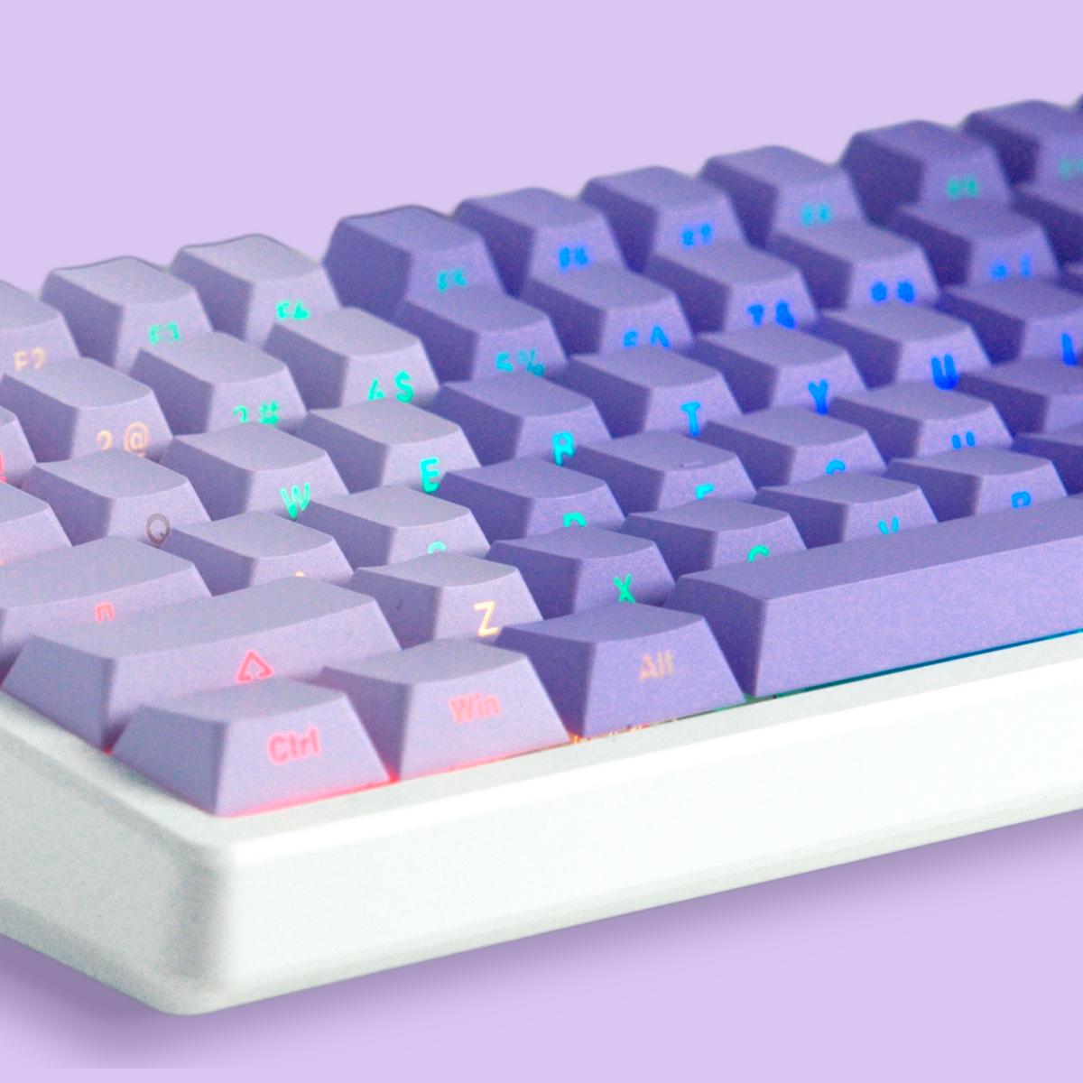 Close-up of cherry-profile keycap set, light gray keys with multicolor printed legends