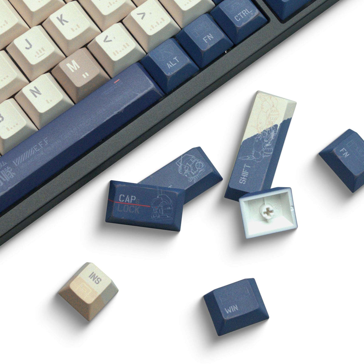 Assorted cherry-profile keycaps in cream and blue, showing CAP LOCK and WIN keys