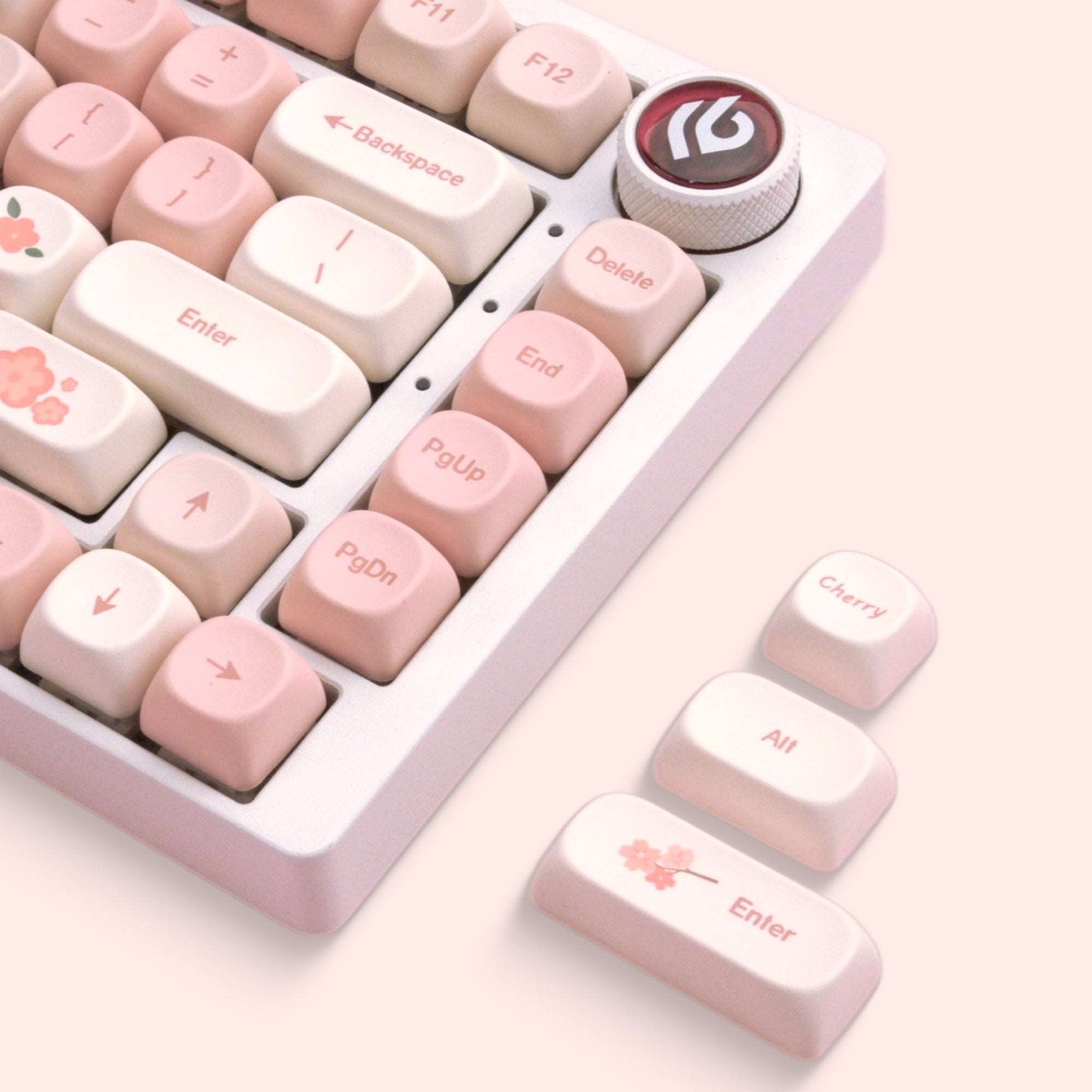 Keycaps showing Enter, Delete, Backspace, and PgDn legends with floral motifs