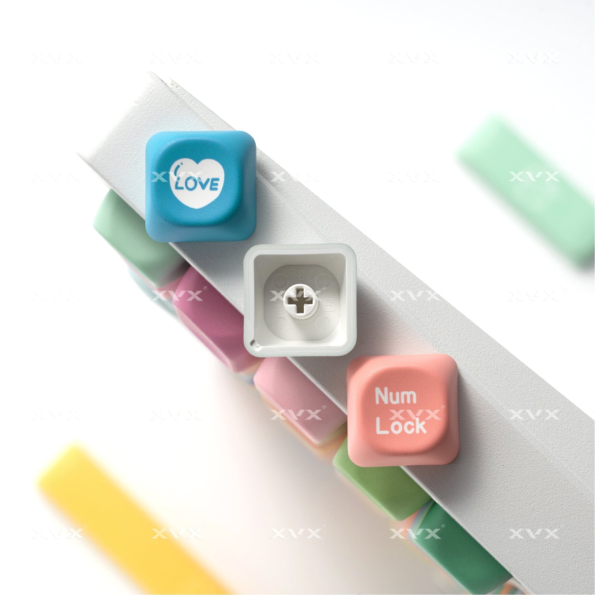 Pastel keycaps featuring LOVE and Num Lock legends with a colorful layered profile