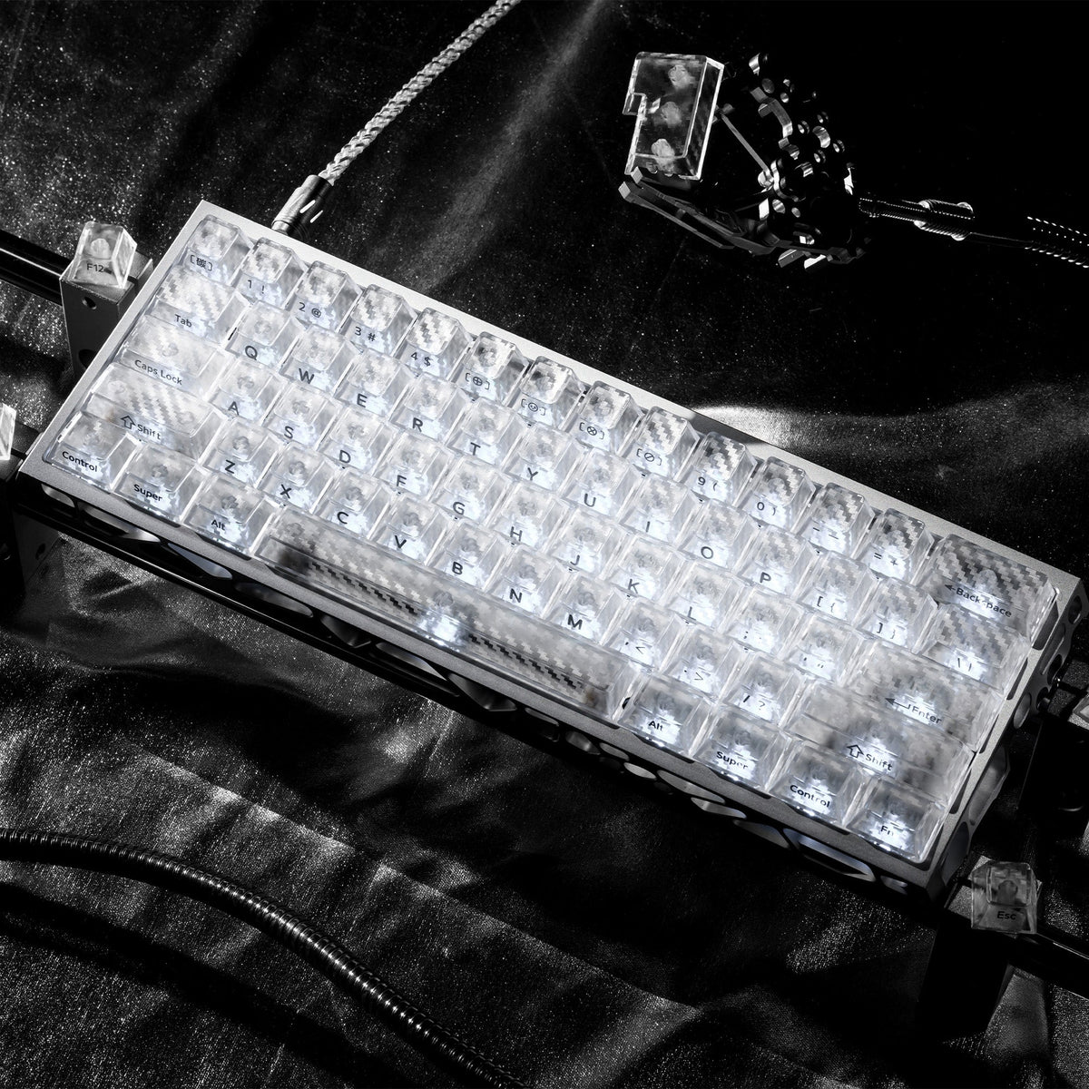 Clear translucent cherry-profile keycap set on keyboard plate, textured carbon-fiber look