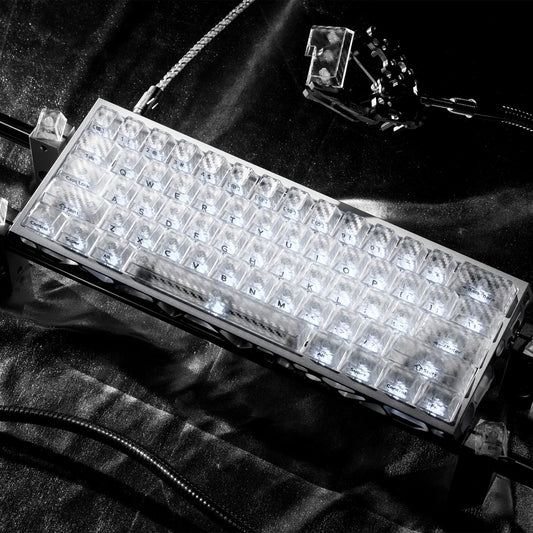 Clear translucent cherry-profile keycap set on keyboard plate, textured carbon-fiber look