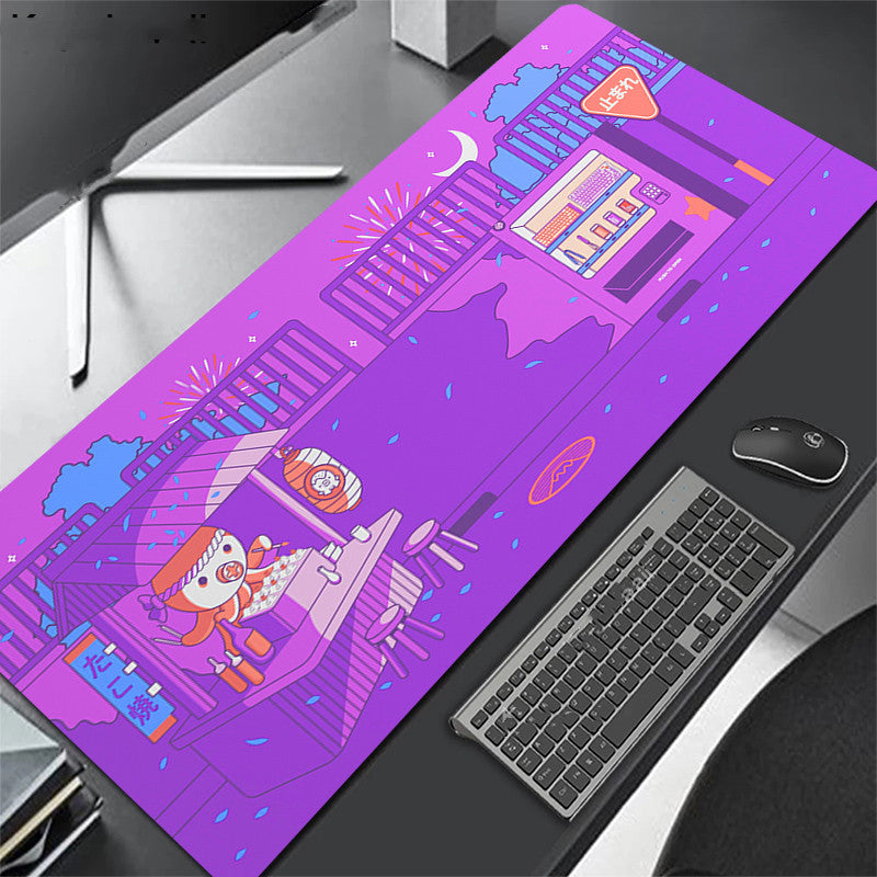 Purple desk mat with cartoon design on a desk with keyboard and octopus.