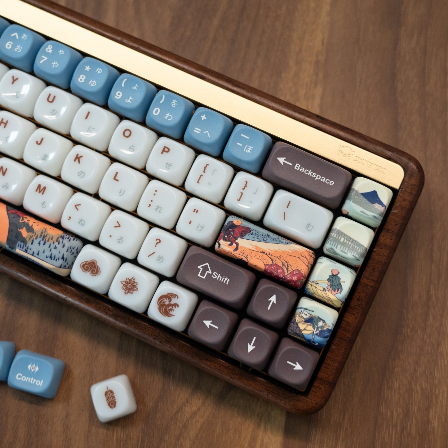 Keyboard with white and blue MOA-profile keycaps, front row shows townscape art