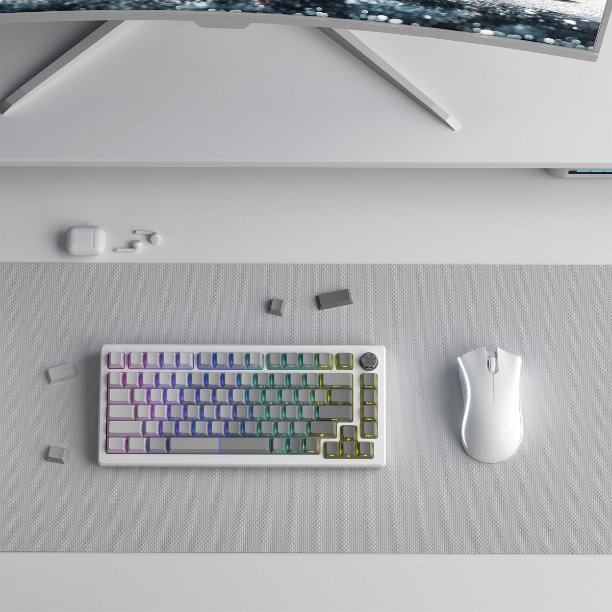 Keyboard keycap set laid out, light blue keys with multicolor legends and purple outlines