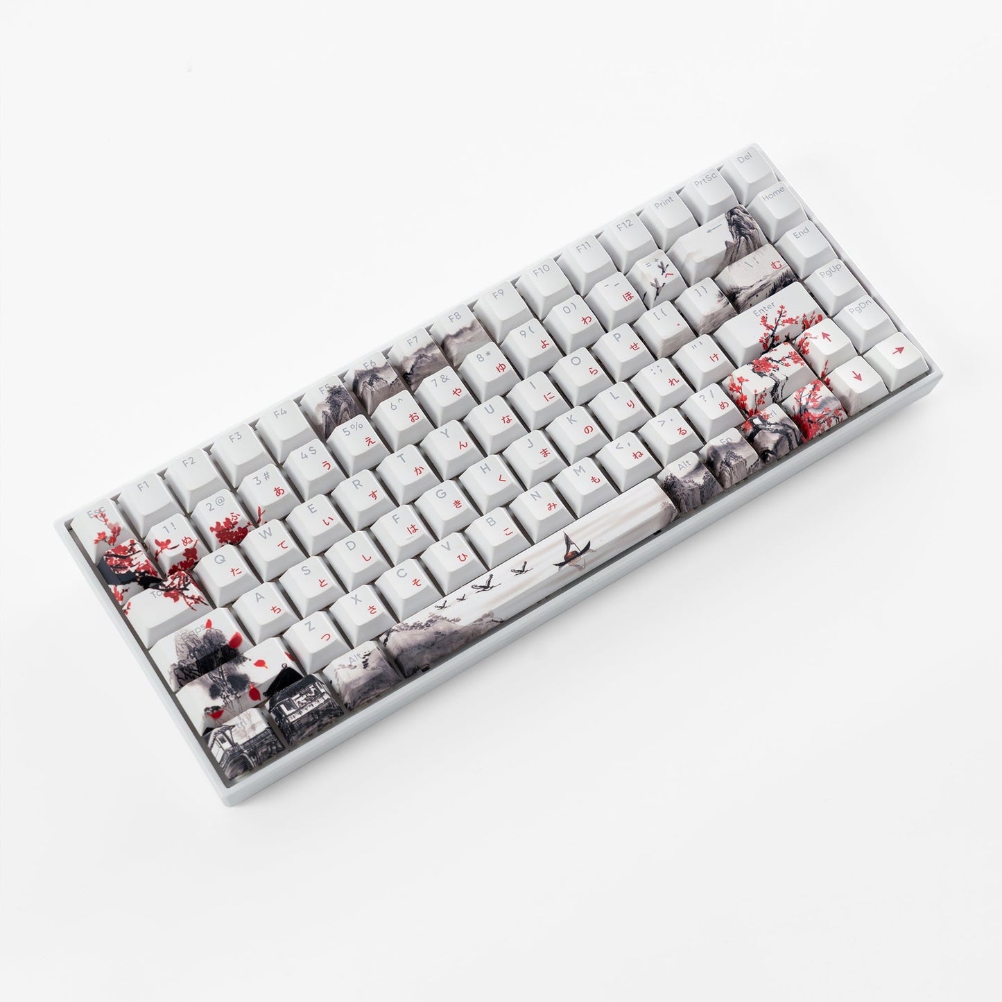 White Cherry-profile keycap set with cherry blossom and cityscape prints, angled view