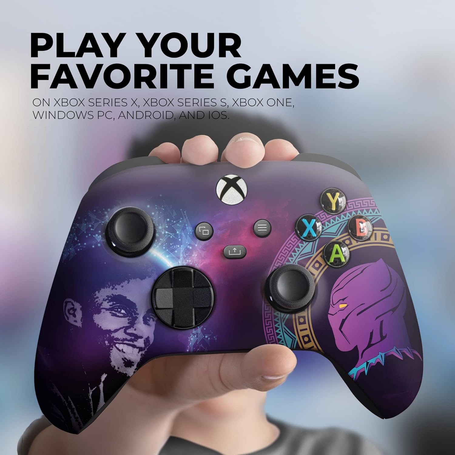 Purple Xbox controller with galaxy print and panther face artwork held in a hand