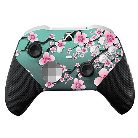 Teal Xbox Elite Core controller with cherry blossom skin, front grips and buttons visible