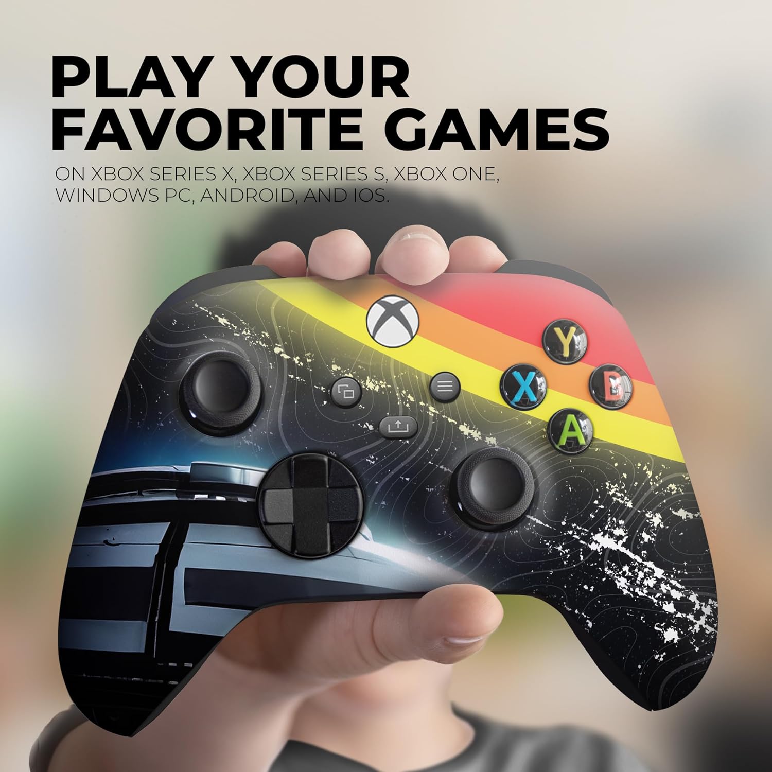 Xbox Series X controller with cosmic galaxy graphic and multicolor ABXY button icons, held in hand