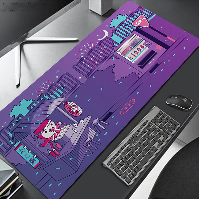 Purple desk mat with cartoon design on a desk with keyboard and octopus.