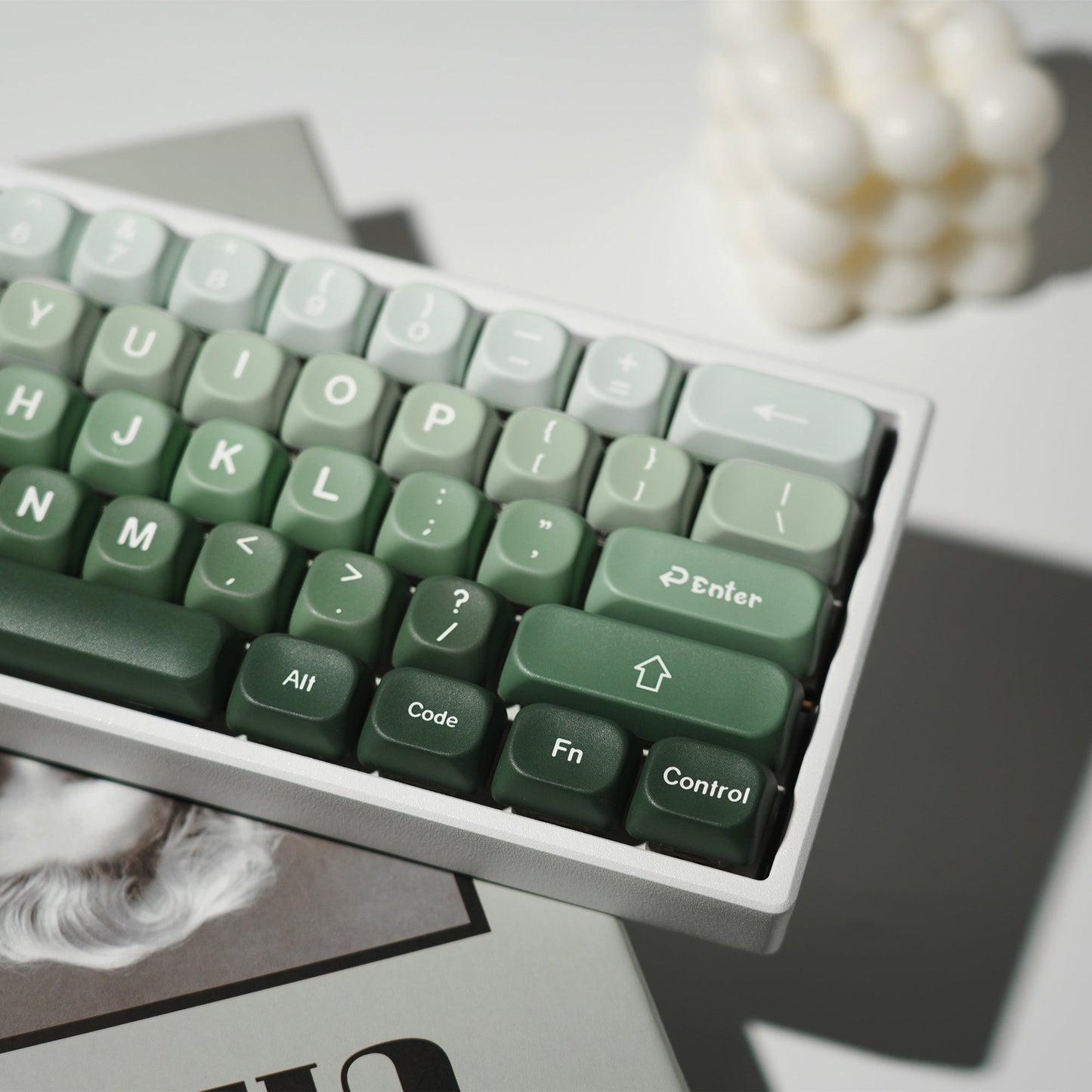Green PBT keycaps close-up, Enter and function keys with white legends