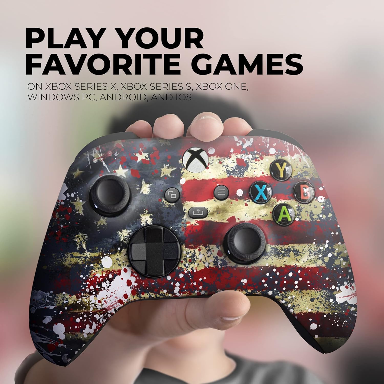 Xbox Series X controller with tattered flag splatter print, held in hand, close-up