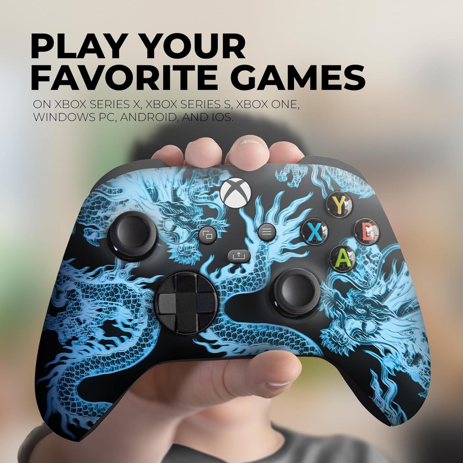 Xbox controller with blue dragon print held toward the camera