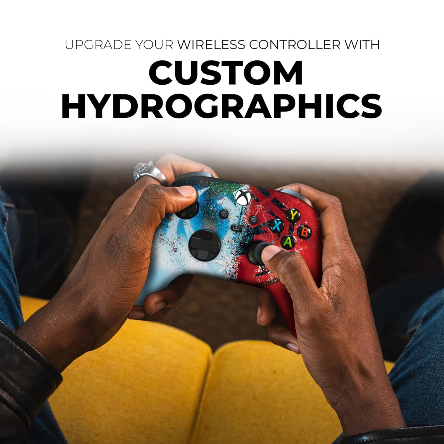Xbox Series X controller in hands with red/blue speckled graphic, colored ABXY buttons, black sticks