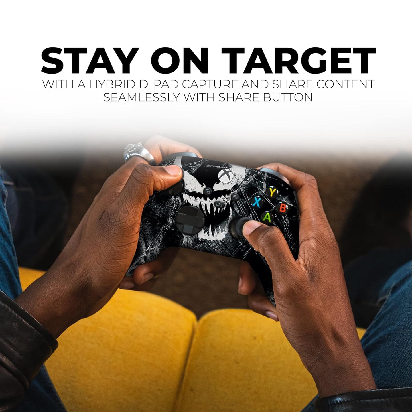 Black Xbox wireless controller held by hands, skull print and colored ABXY buttons visible