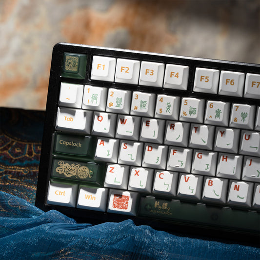 Cherry-profile keycap set in white with green modifier keys and colorful legend printing