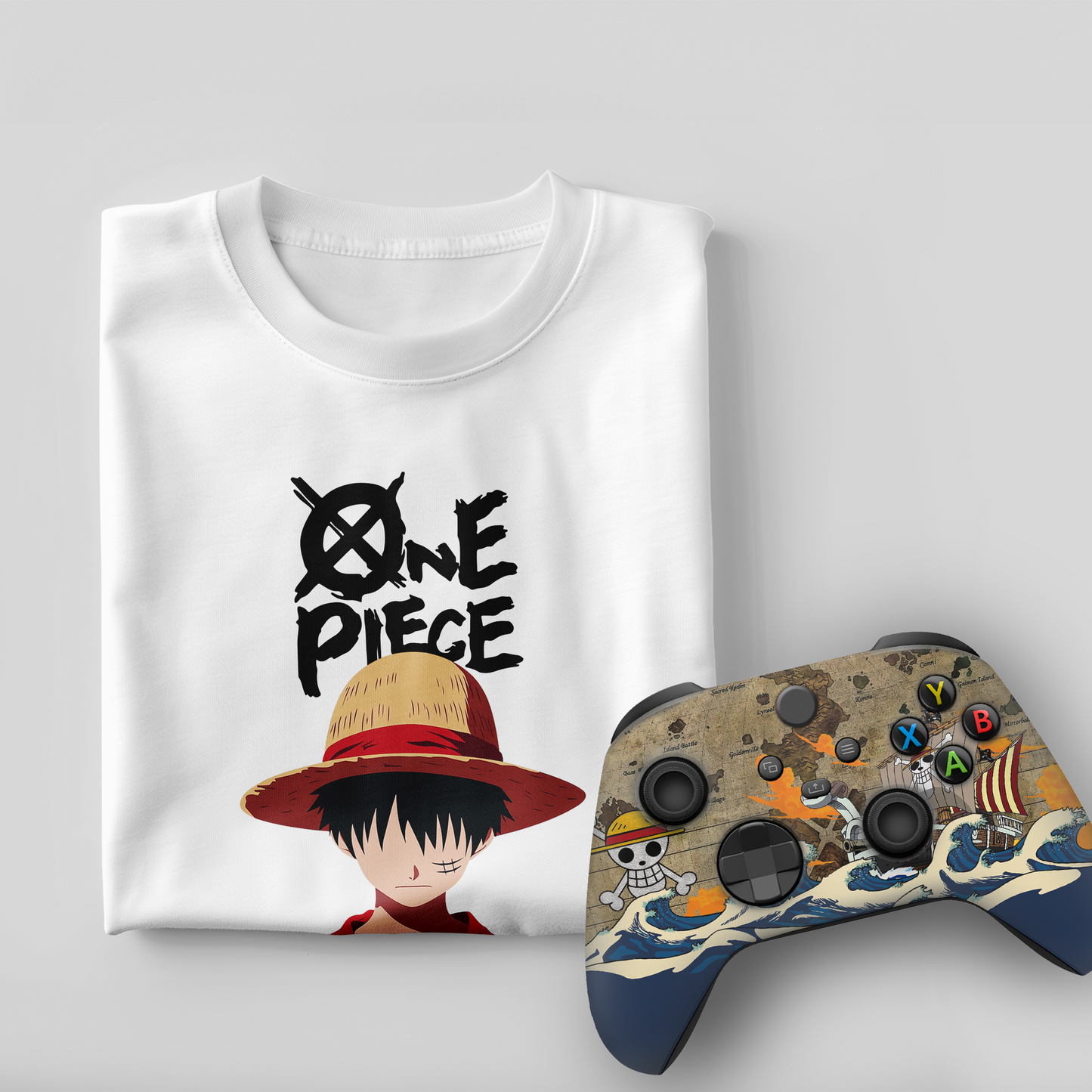 White graphic T-shirt with One Piece character and Xbox controller with pirate wave design