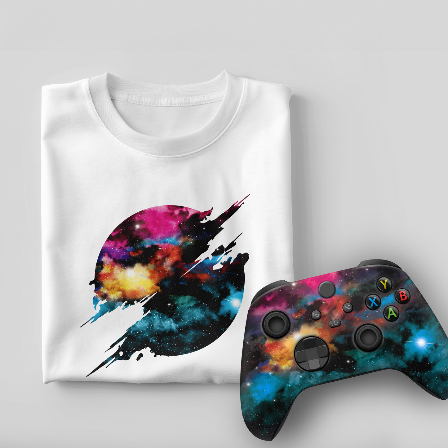 White T-shirt with galaxy jet graphic and matching Xbox Series X controller (angled)