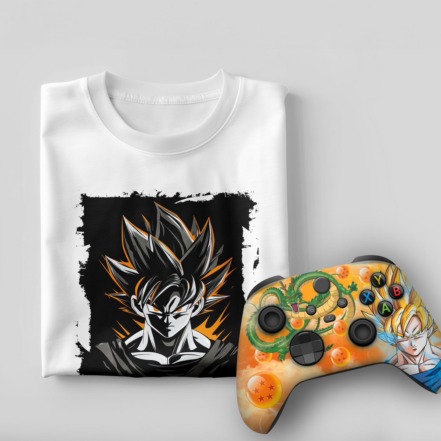 White graphic t-shirt with Goku print and orange themed Xbox controller, front view