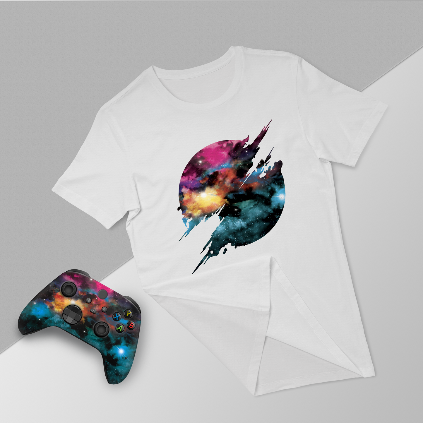 White T-shirt with galaxy jet graphic, with Xbox Series X controller and folded tee