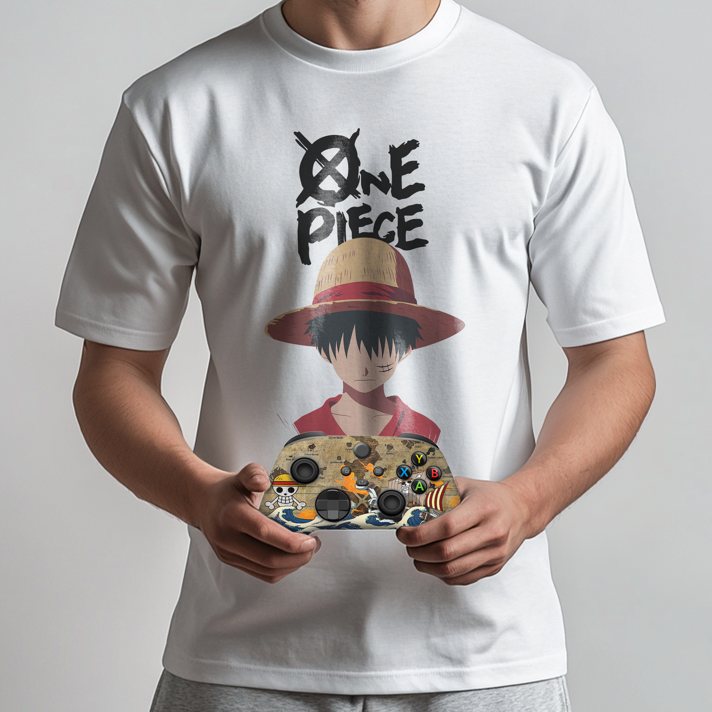 White graphic T-shirt with One Piece character and Xbox controller held by person