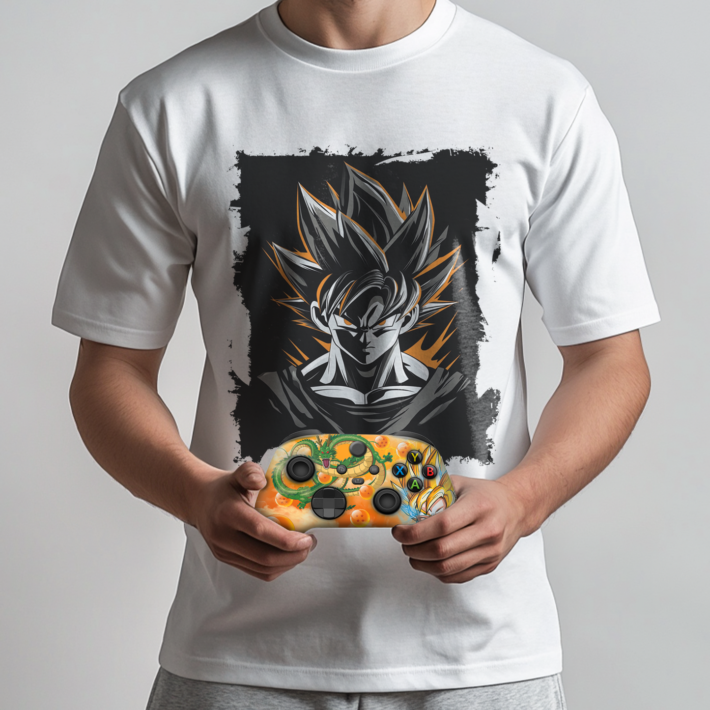 White graphic t-shirt with Goku chest print; orange themed Xbox controller in hands