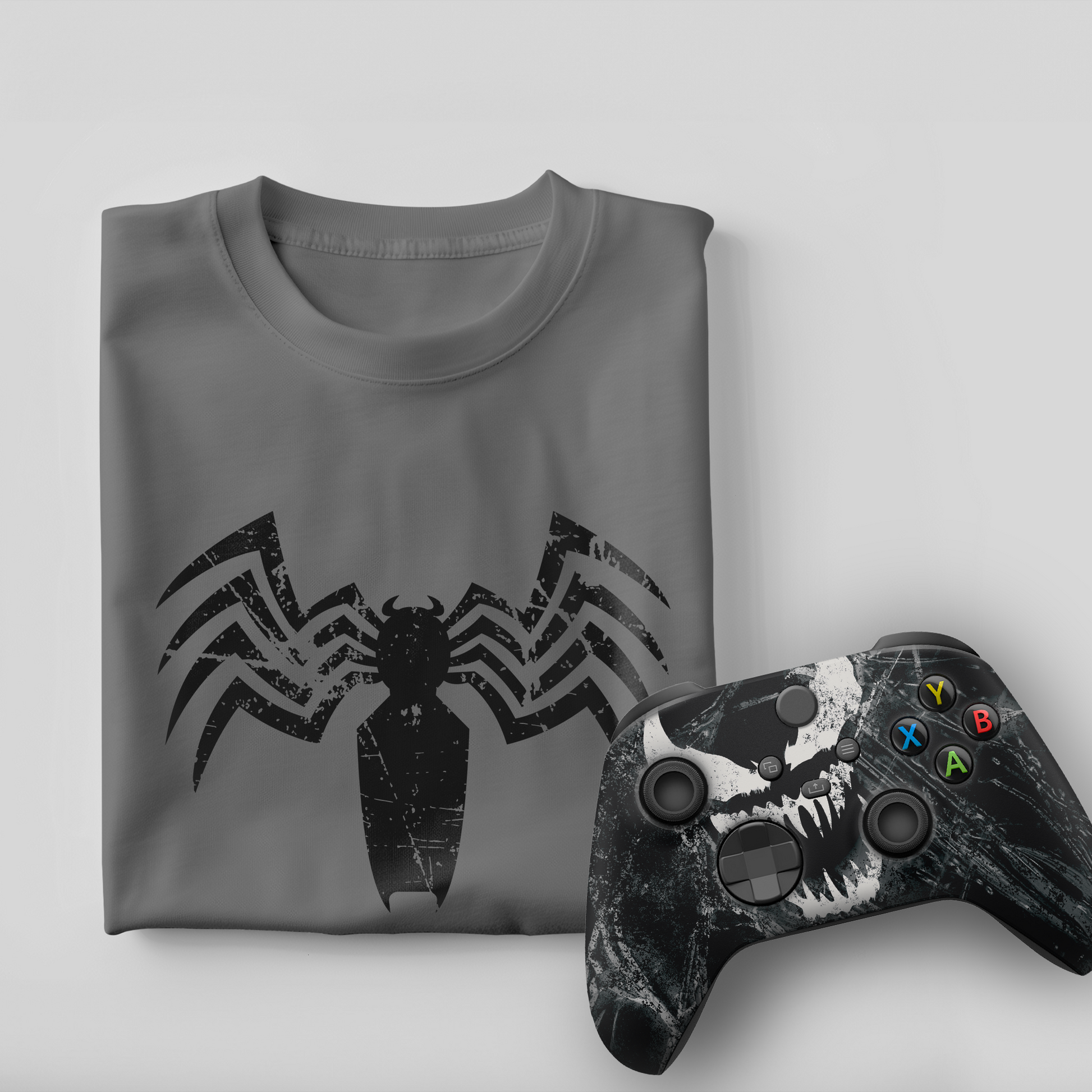 Gray venom graphic t-shirt with black Xbox controller