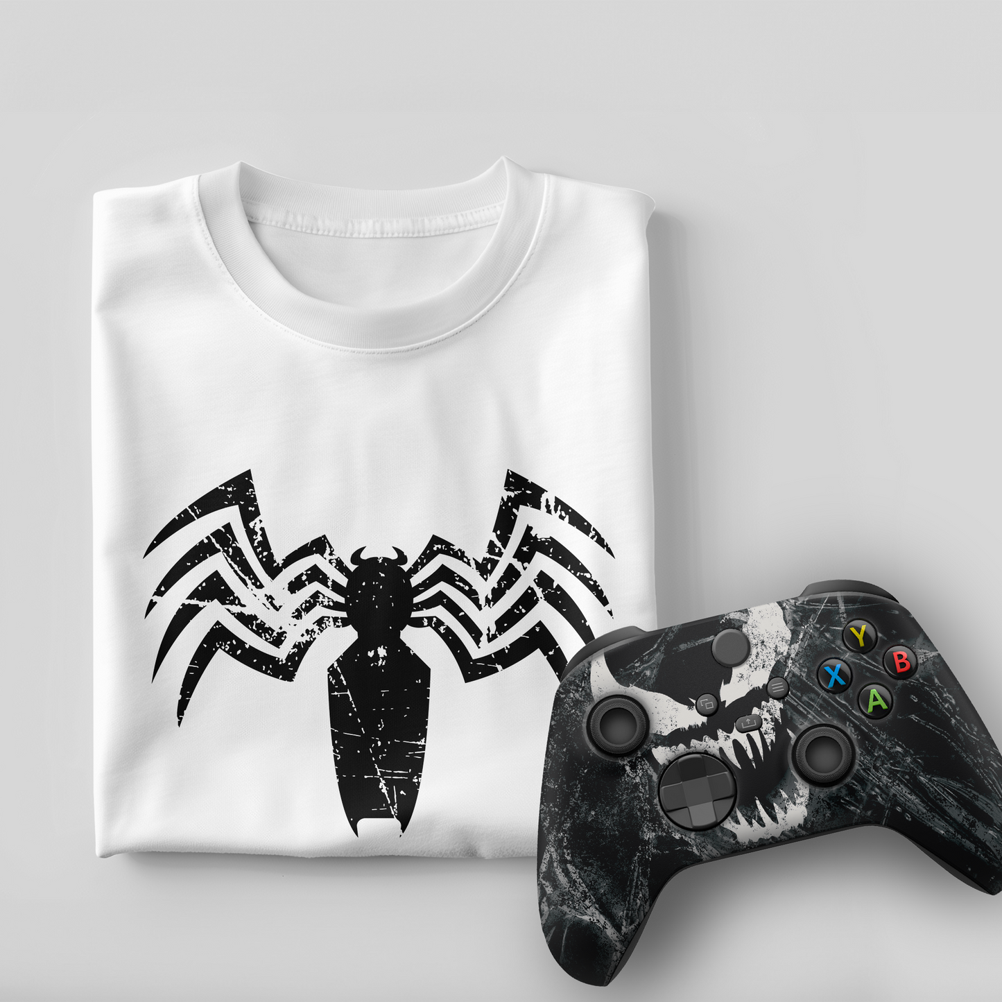 White venom graphic t-shirt with black Xbox controller