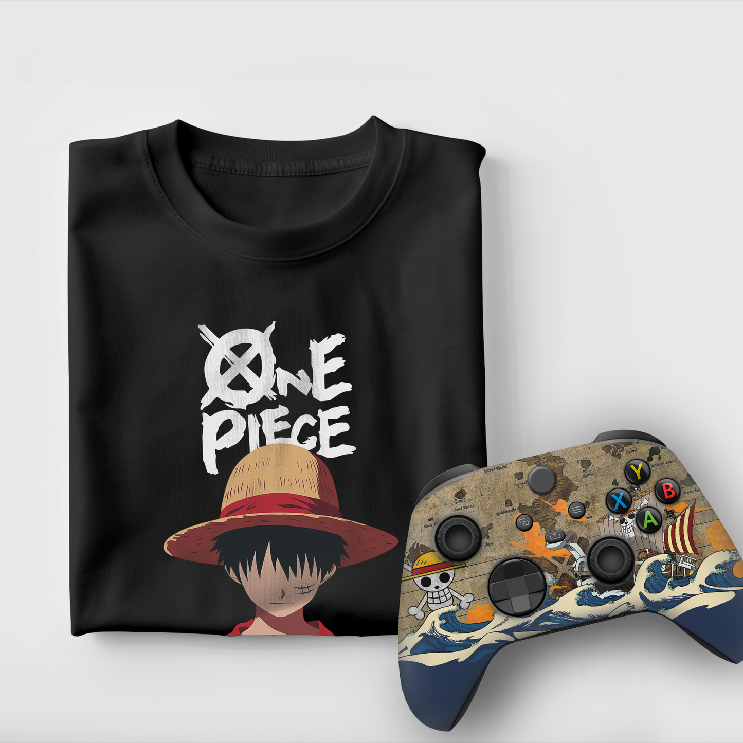 Black graphic T-shirt with character-in-hat print; Xbox controller with custom art.