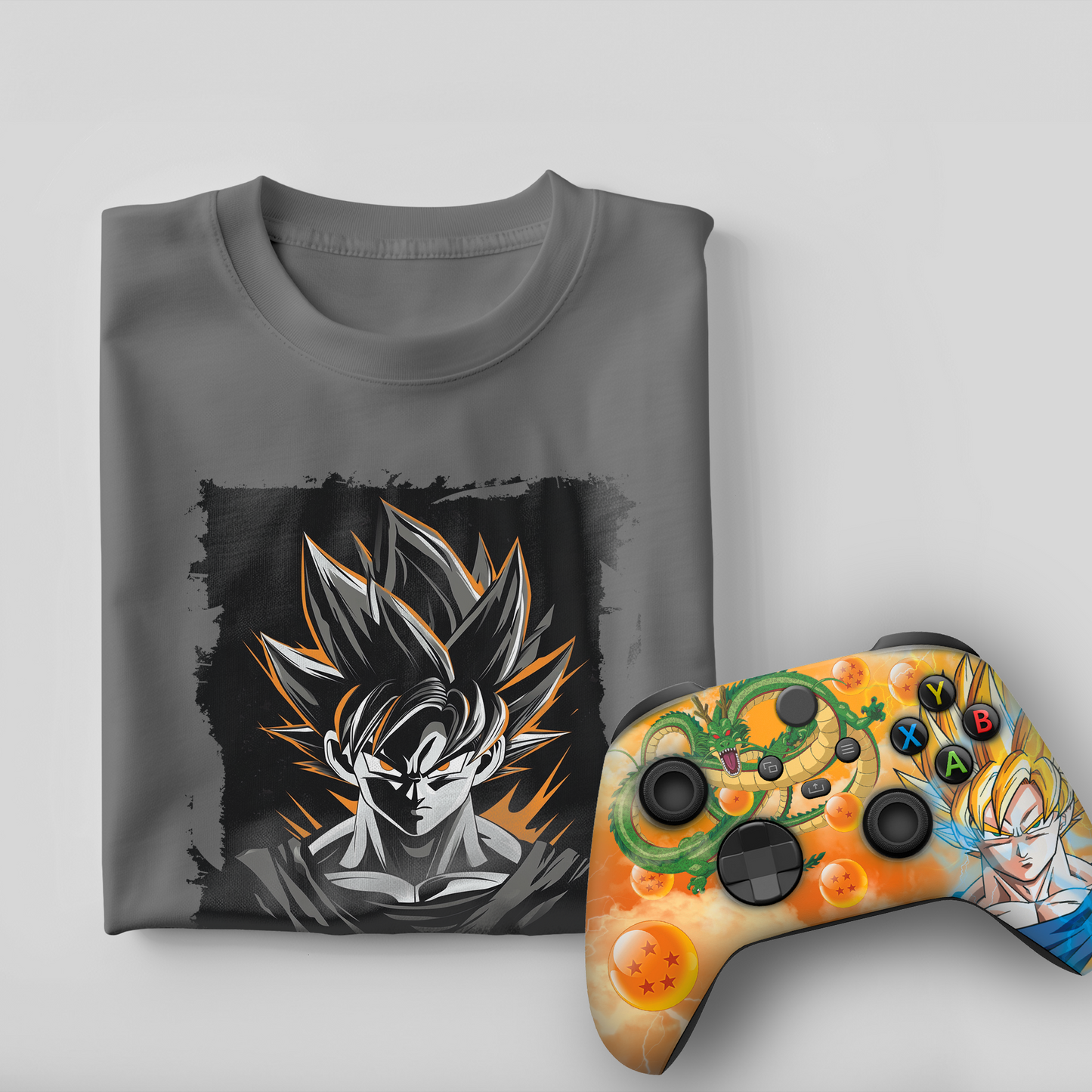 Gray graphic t-shirt with Goku print and orange themed Xbox controller, front view