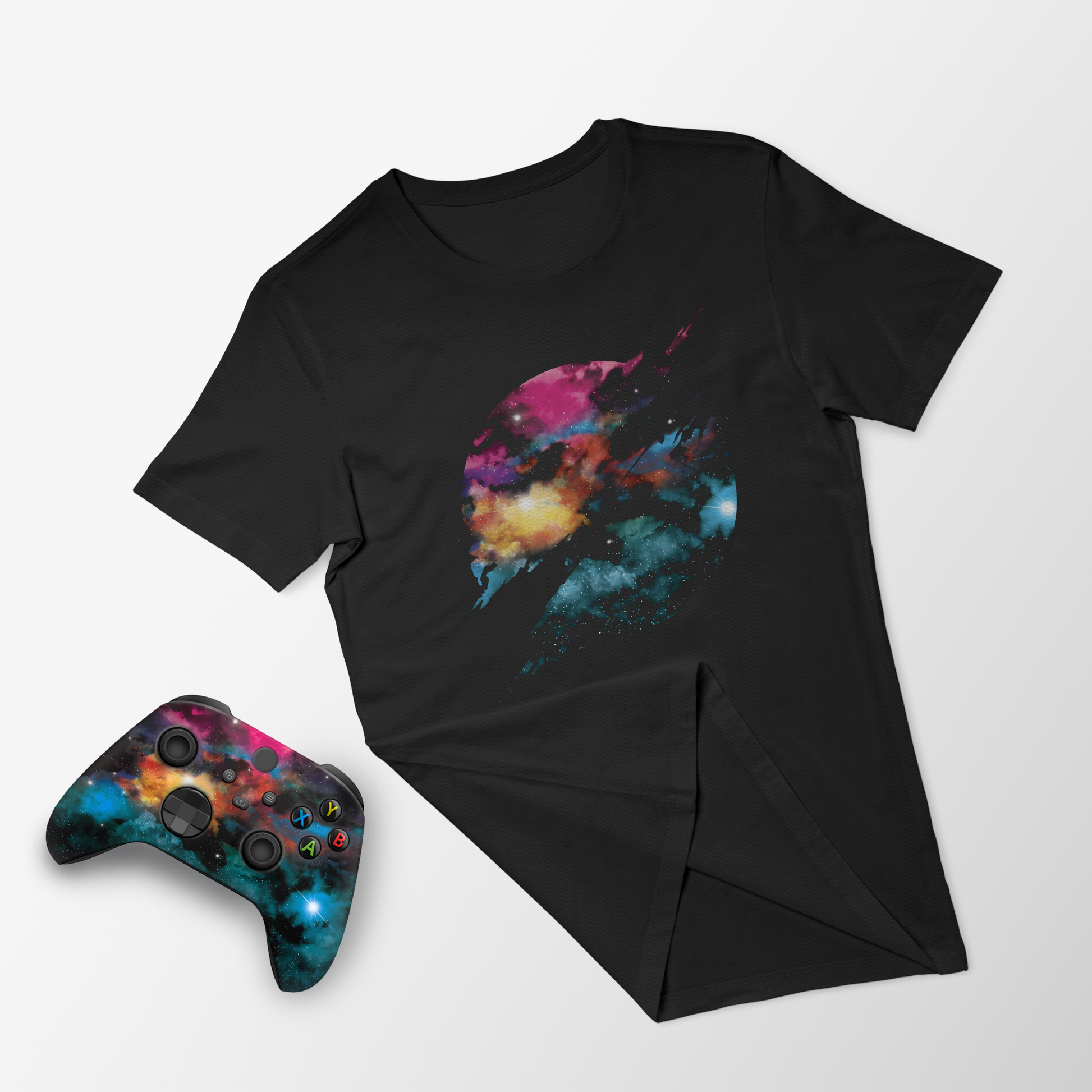 Black galaxy T-shirt and Xbox controller with colorful space nebula print