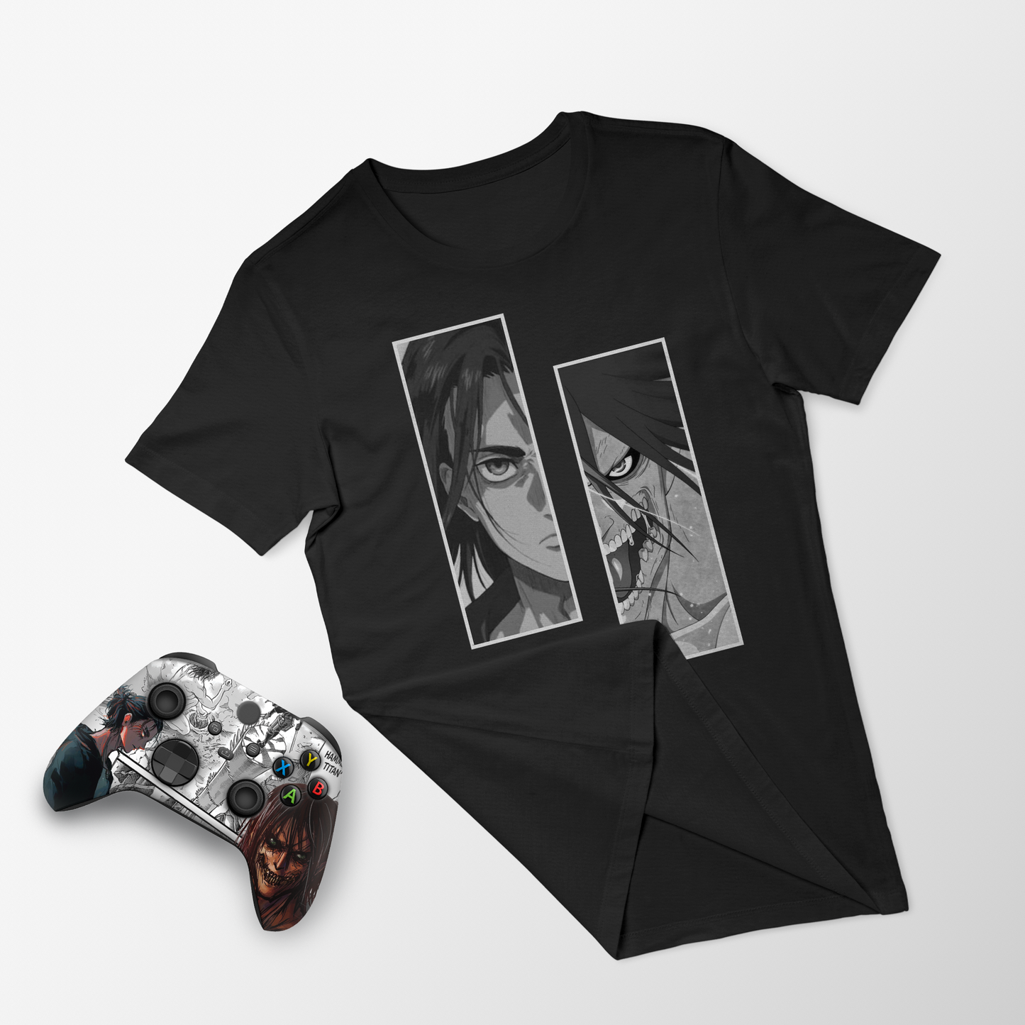 Black graphic T-shirt with two portrait panels; paired Xbox controller on side