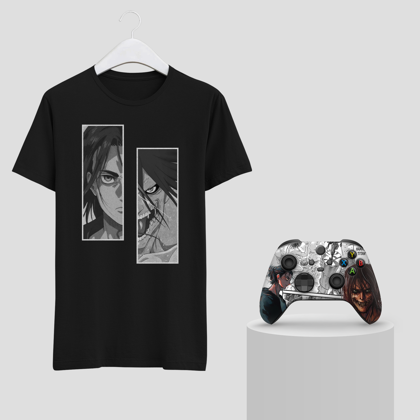 Black graphic T-shirt on hanger with two portrait panels; silver Xbox controller