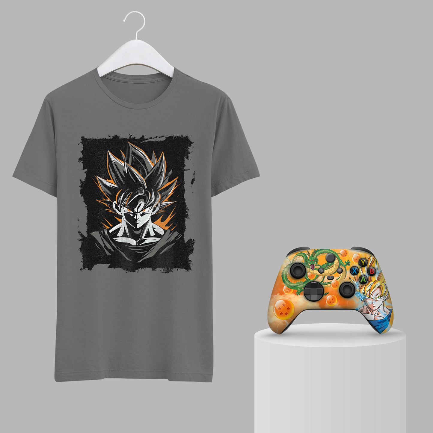 Gray graphic t-shirt with Goku face print and orange themed Xbox controller on stand