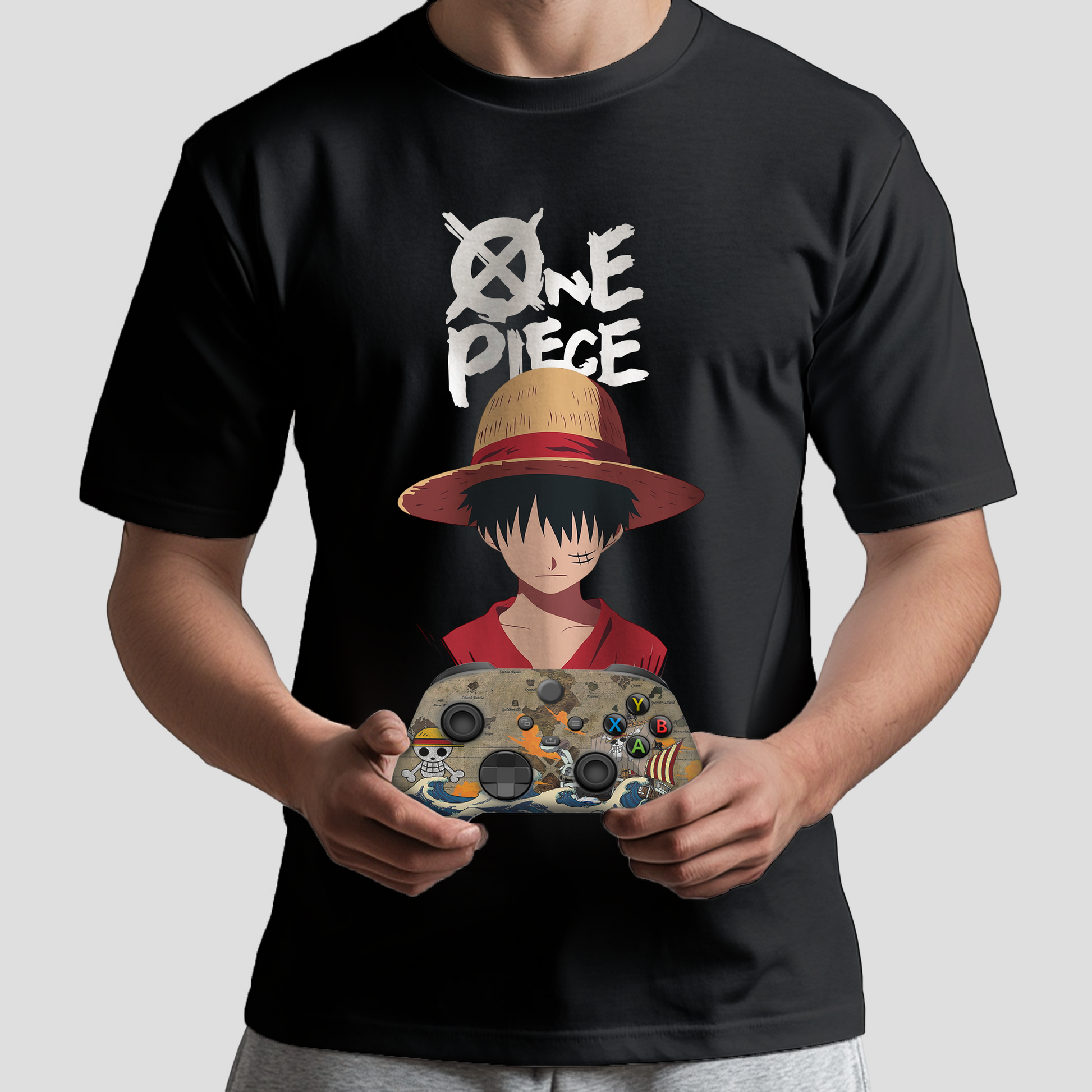 Black T-shirt worn by model with character-in-hat print; holding a custom Xbox controller.