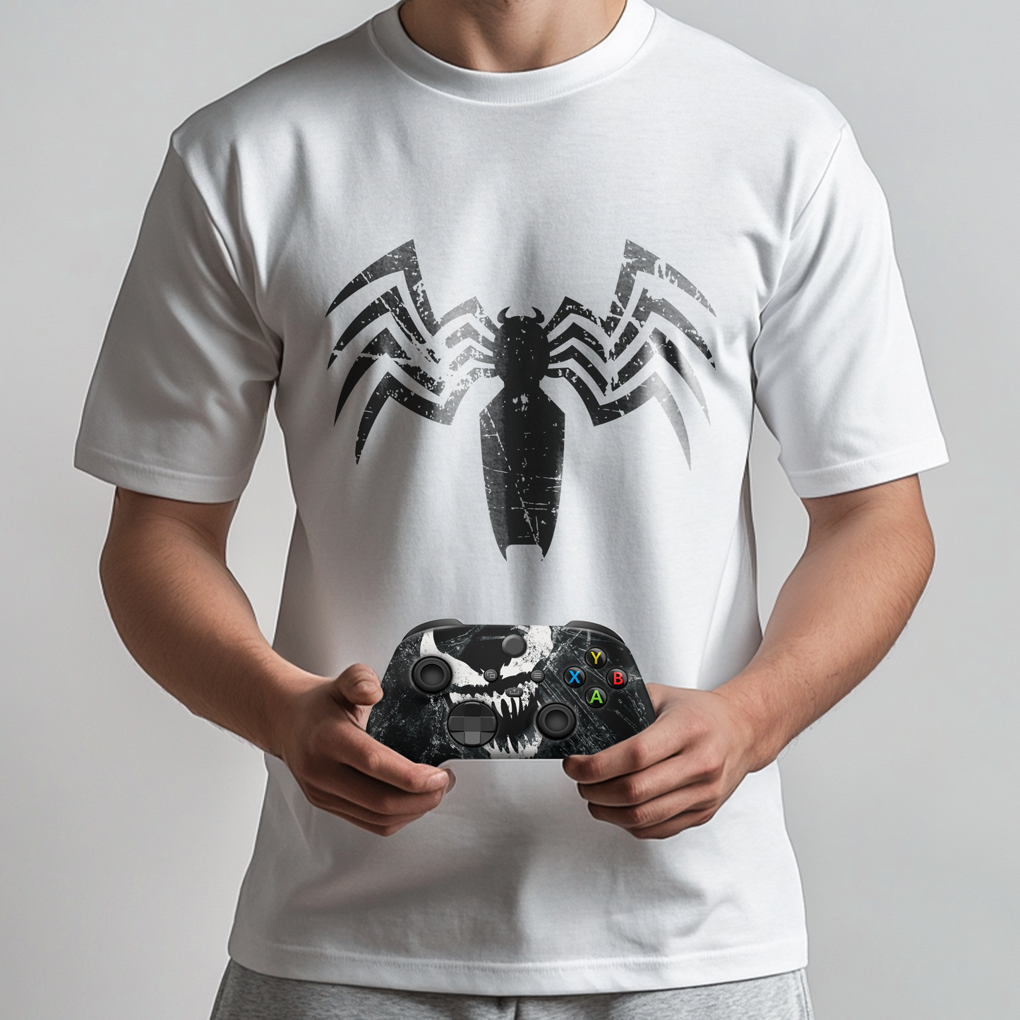 White venom graphic t-shirt worn with black Xbox controller