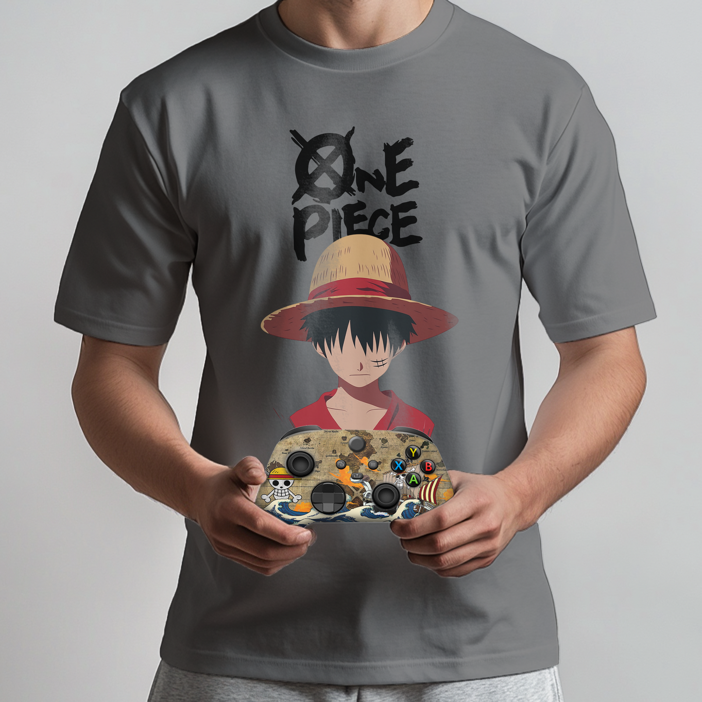 Gray graphic T-shirt with One Piece character and Xbox controller held by person