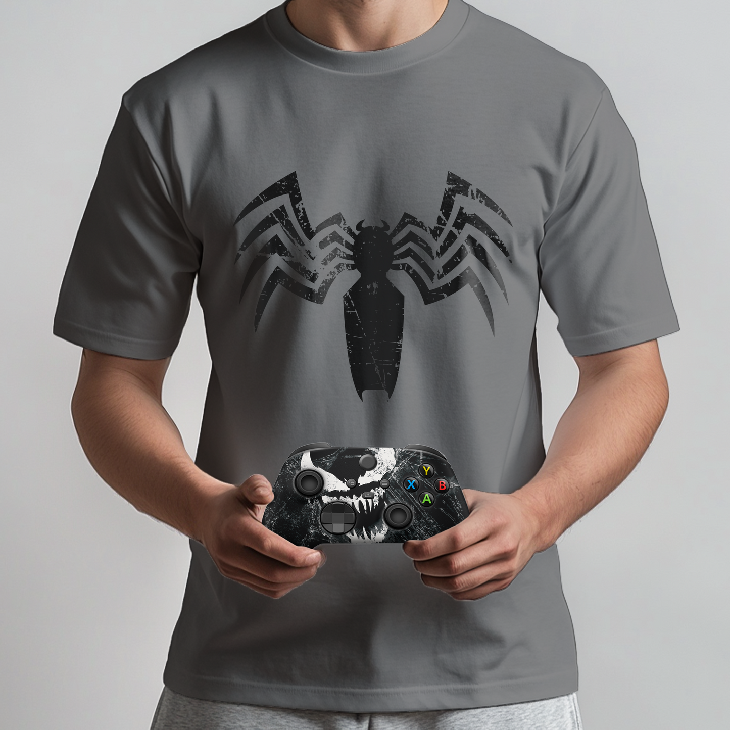 Gray venom graphic t-shirt worn with black Xbox controller